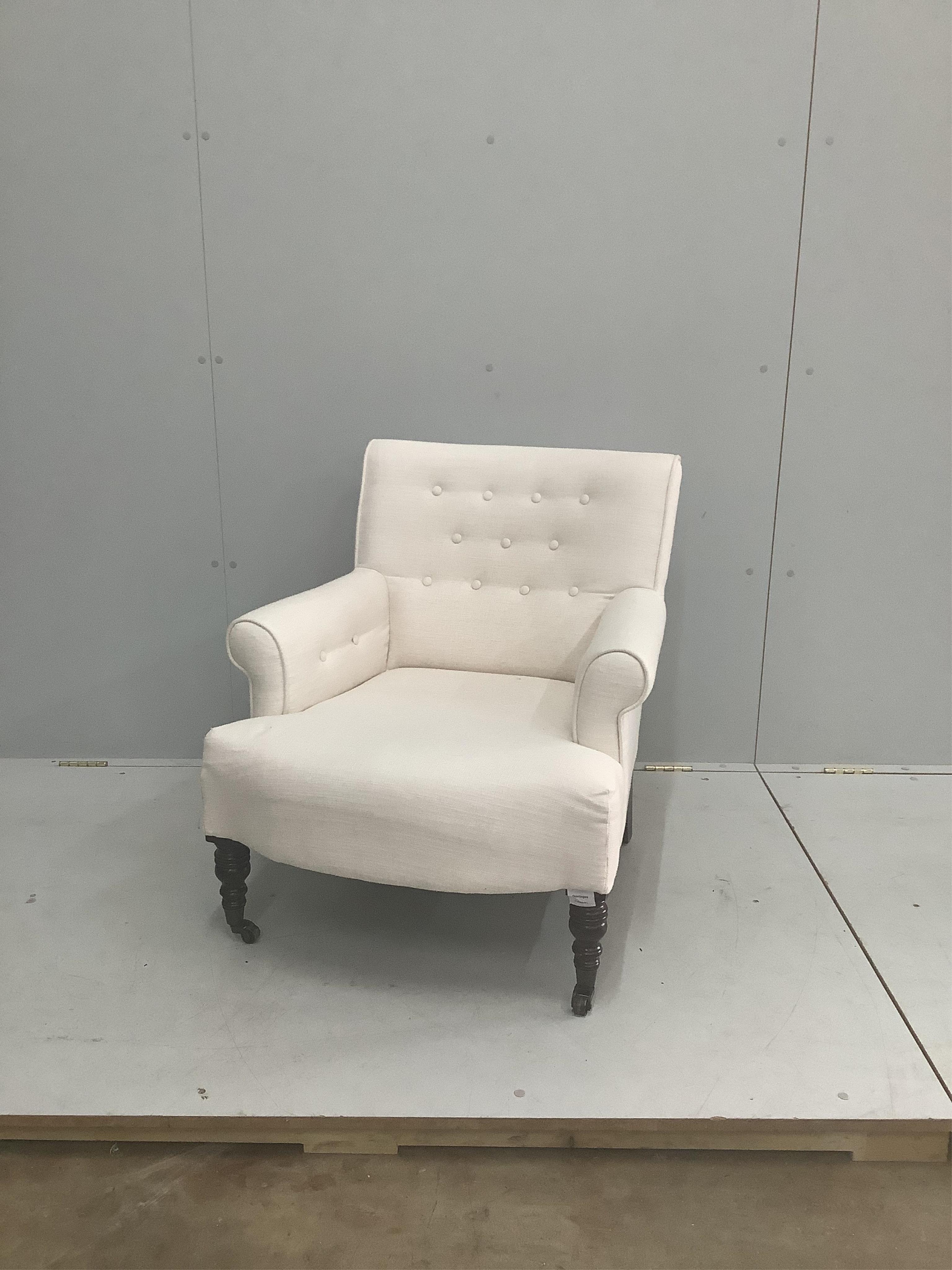 A modern Victorian style upholstered armchair, width 72cm, depth 70cm, height 76cm. Condition - fair